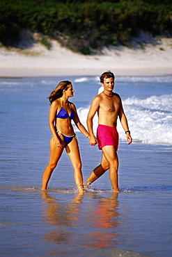 A couple running through the seawater, Horse-shoe Bay beach, Bermuda