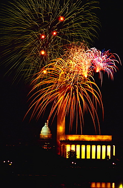 Low angle view of fire works display at night, Lincoln Memorial, Washington Monument, Washington DC, USA