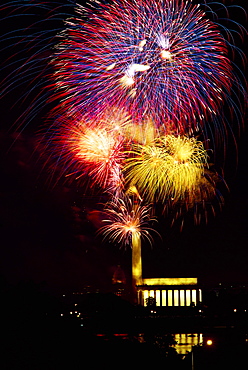 Low angle view of fire works display at night, Lincoln Memorial, Washington Monument, Washington DC, USA