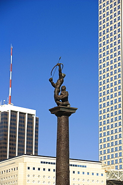 Low angle view of a statue in front of buildings in a city, Miami, Florida, USA