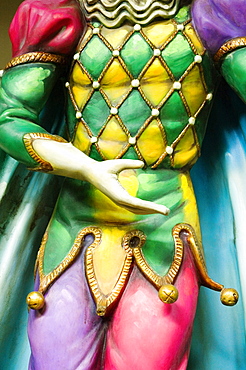 Mid section view of the painted statue of a joker, New Orleans, Louisiana, USA