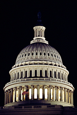 Low angle view of an American flag on a government building, Capitol Building, Washington DC, USA