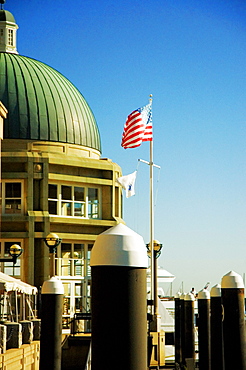 American Flag in front of a building, Rowes Wharf, Boston Harbor, Boston, Massachusetts, USA