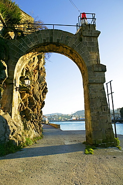 Low angle view of an arched gateway on a street, Spain