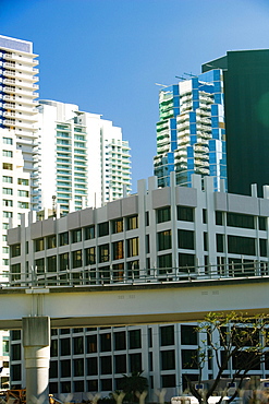 Low angle view of a bridge in front of buildings, Miami, Florida, USA