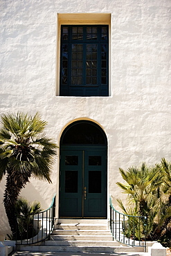 Arched doorway in a stucco building, San Diego, California, USA