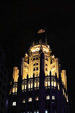 Low angle view of tower at night, Tribune Tower, Chicago, Illinois, USA