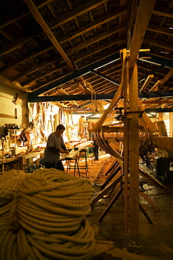 Side profile of a carpenter working in a workshop, Spain