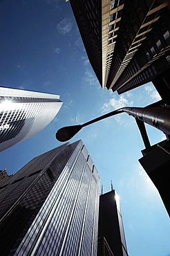 Low angle view of skyscrapers in a city, Chicago, Illinois, USA