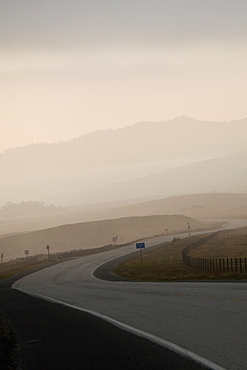 Empty stretch of road at dusk