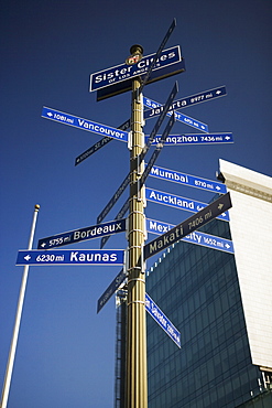 Low angle view of directional signs