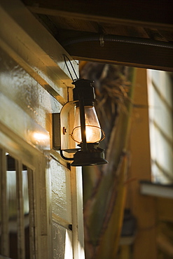 Low angle view of a lantern on a porch