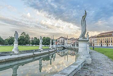 The Prato della Valle town square with sculptures and a canal, Veneto, Italy.