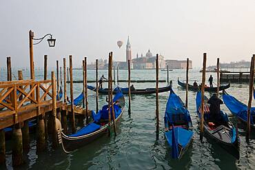 Venice, Gondolas moored at Piazza San Marco, view to San Giorgio Maggiore, Venice, Italy