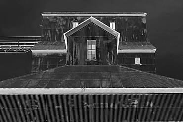 Black and white image of grain silo roofs