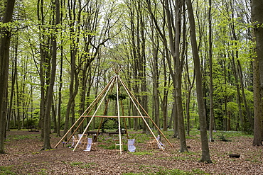 Wooden structure with wreath for a woodland naming ceremony.