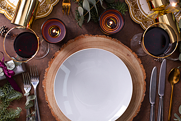 Christmas, a table setting, overhead view, wine and candles, plates and cutlery