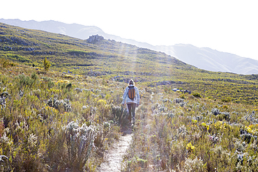 Family hiking a nature trail, Phillipskop nature reserve, Stanford, South Africa.