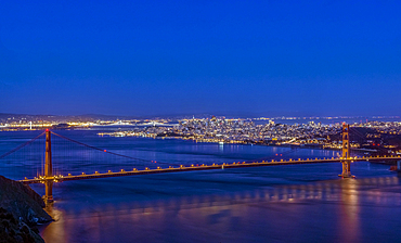 Golden Gate bridge across San Francisco bay at twilight.