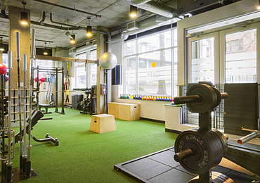 Weights room in an empty gym.