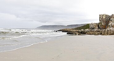 The jagged rocks and coastline of the Atlantic coast at Grotto Beach, a wide beach near Hermanus, Grotto Beach, Western Cape, South Africa