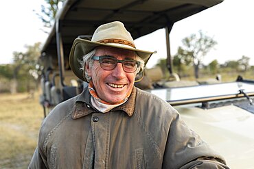 smiling safari guide, Okavango Delta, Botswana, Okavango Delta, Botswana