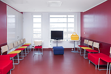 Corridor and waiting areas of a modern hospital with seating Yellow bag.