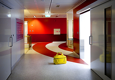 Corridor and waiting areas of a modern hospital with seating