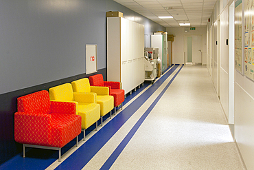 Corridor and waiting areas of a modern hospital with seating