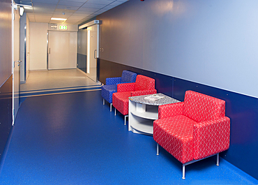 Corridor and waiting areas of a modern hospital with seating