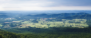 Shenandoah Valley vista, elevated view over rolling countryside, fields and farms in Virginia.