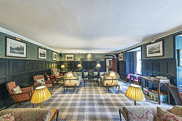 Hotel lounge with Scottish themed decoration, including tartan carpet.