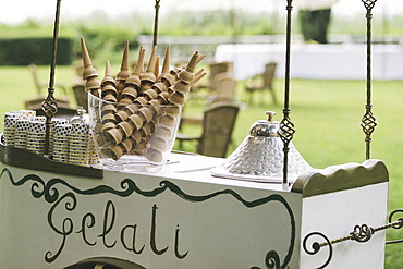 Gelati stand, icecream vendor's trolley, signs and ice cream cones, Icecream stand, Varese, Italy