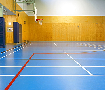 Gymnasium and basketball court, large empty gym.