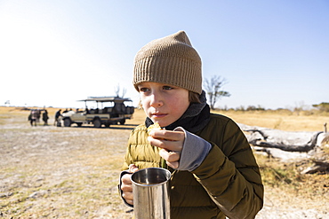young boy on safari,Okavango Delta, Botswana, Okavango Delta, Botswana