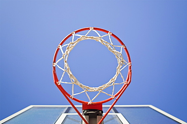 Basketball hoop, metal ring and netting, view from underneath.