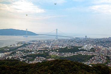 View over the city of Kobe and Akashi Kaikyo Bridge suspension bridge, linking Honshu to Iwaya.