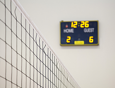 A school sports hall, the electronic scoreboard.