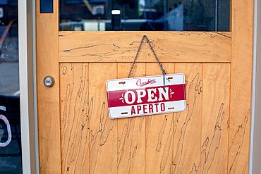 An Open sign on a restaurant door. -