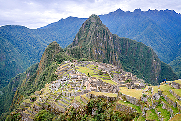 The path to Machu Picchu, the high mountain capital of the Inca tribe, a 15th century citadel site, buildings and view of the plateau and Andes mountains.