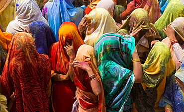 A colourful crowd of people celebrate the Holi Festival, Mathura, Uttar Pradesh, India, Mathura, Uttar Pradesh, India