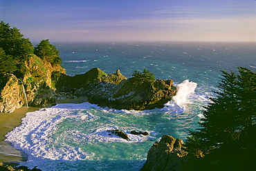 The coastline and a horseshoe bay with waves crashing against the rocks in Julia Pfeiffer Burns State Park, Julia Pfeiffer Burns State Park, California, USA