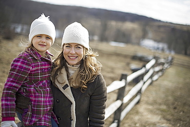 A woman and child walking along a path hand in hand, Cold Spring, New York, USA