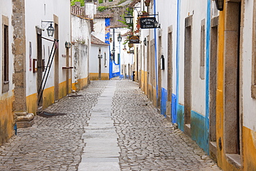 A quiet narrow street of traditional houses in the village of Sonega, Sonega, Portugal