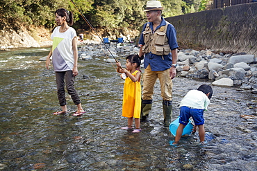 Family fishing in a stream, Kyoto, Honshu Island, Japan