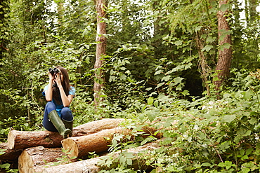 A young girl, a birdwatcher, Bristol, Avon, England