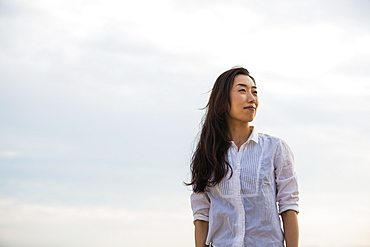 A woman on a beach in Kobe, Kobe, Japan