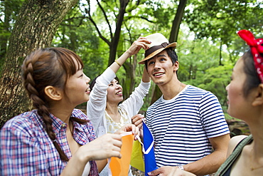 Group of friends at an outdoor party in a forest, Kyoto, Japan