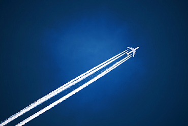 A jet vapour trail across a dark blue sky, Jet contrail, Saskatchewan, Canada