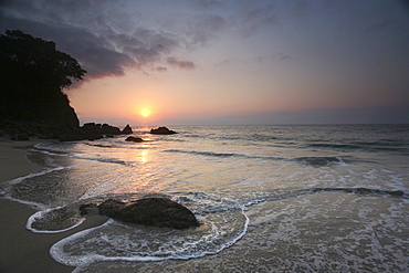 Sunset and a view across a beach and headland in Puerto Vallarta, Puerto Vallarta, Mexico